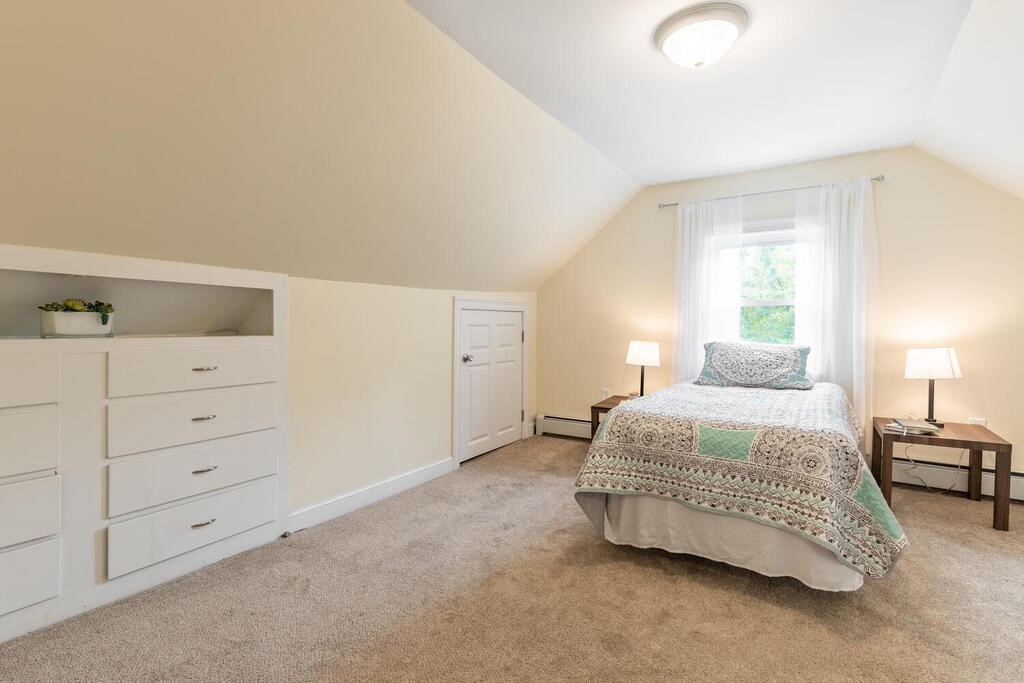 18 Woodbury Road Billerica, MA 01821 - Photo 23 of 30 a bedroom with a bed and lamp