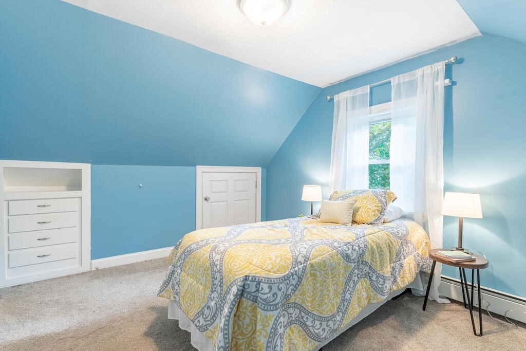 18 Woodbury Road Billerica, MA 01821 - Photo 24 of 30 a bedroom with a bed and a lamp