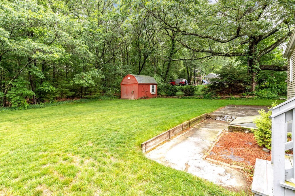 18 Woodbury Road Billerica, MA 01821 - Photo 26 of 30 a view of a swimming pool with a garden