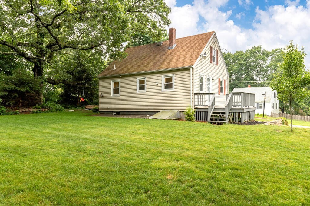 18 Woodbury Road Billerica, MA 01821 - Photo 30 of 30 a view of a house with a backyard