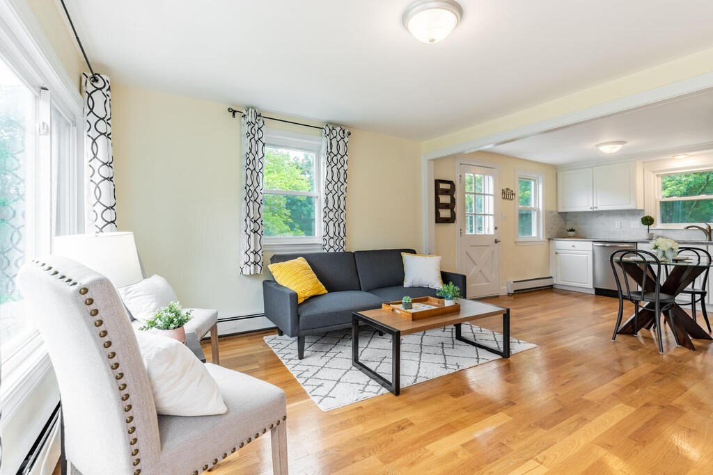 18 Woodbury Road Billerica, MA 01821 - Photo 7 of 30 a living room with furniture and a large window