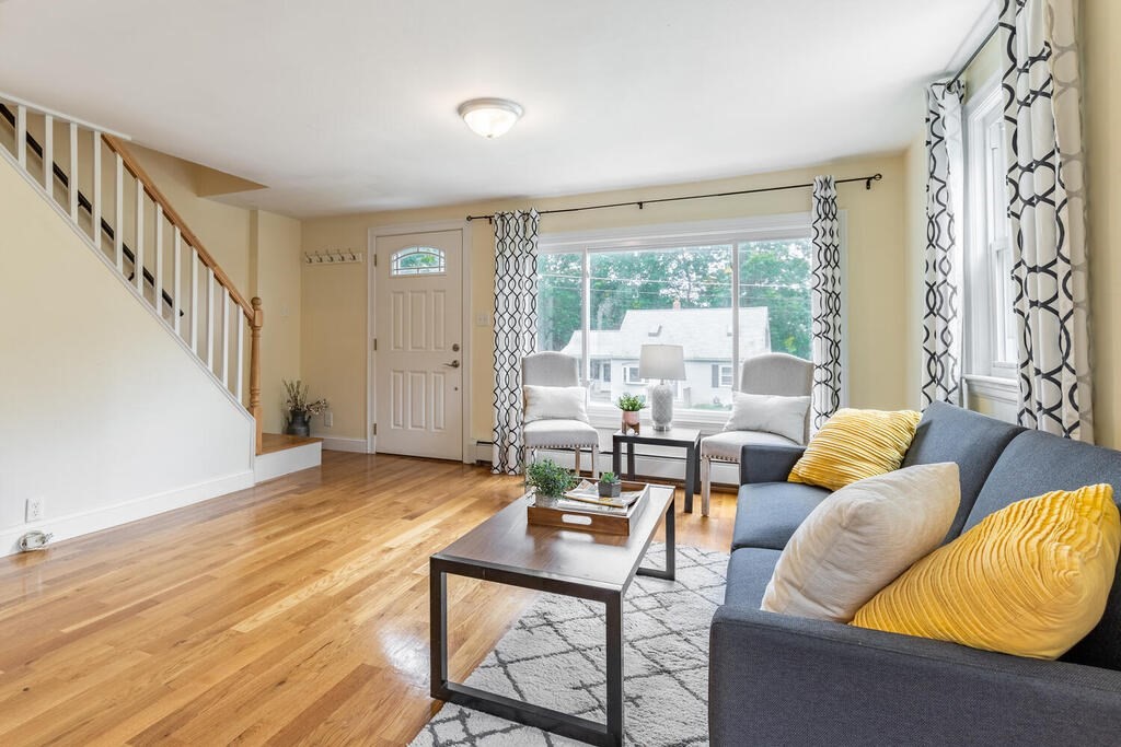 18 Woodbury Road Billerica, MA 01821 - Photo 9 of 30 a living room with furniture and a table