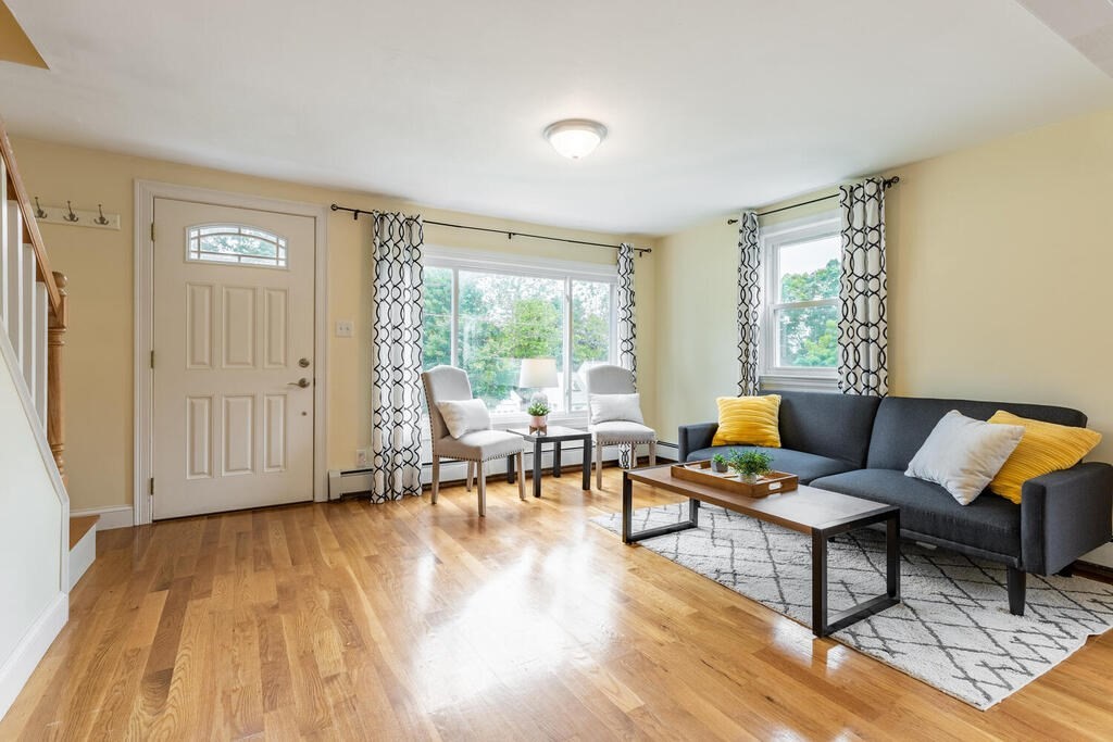 18 Woodbury Road Billerica, MA 01821 - Photo 10 of 30 a living room with furniture and a wooden floor