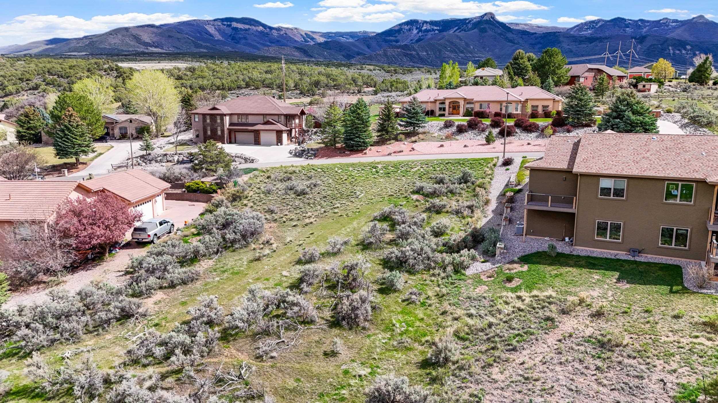 143 Boulder Ridge Drive Parachute, CO 81635 - Photo 11 of 11 a view of a house with a yard and a car park