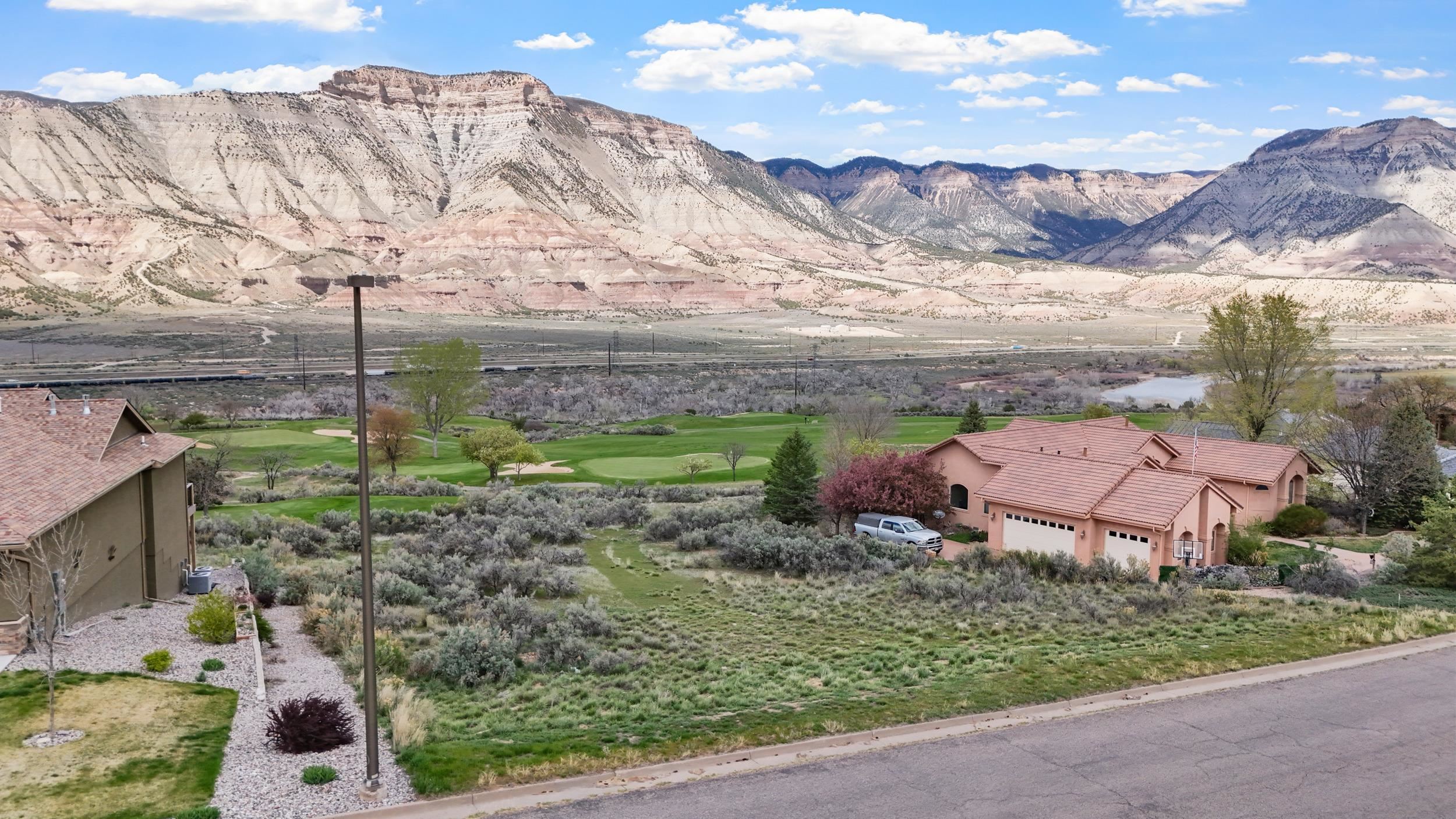 143 Boulder Ridge Drive Parachute, CO 81635 - Photo 2 of 11 a view of a city with a mountain