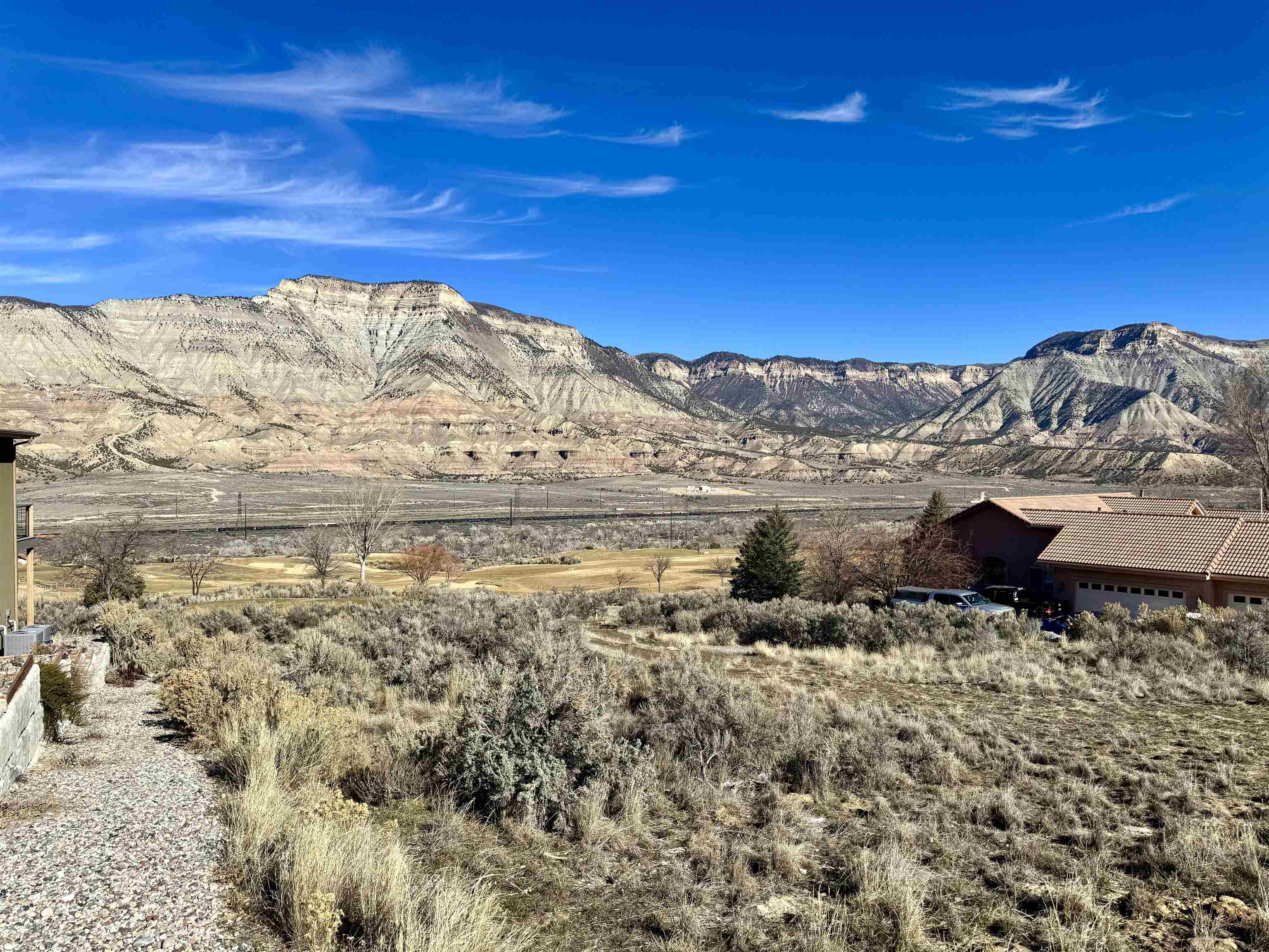 143 Boulder Ridge Drive Parachute, CO 81635 - Photo 5 of 11 a view of a large building with mountains in the background