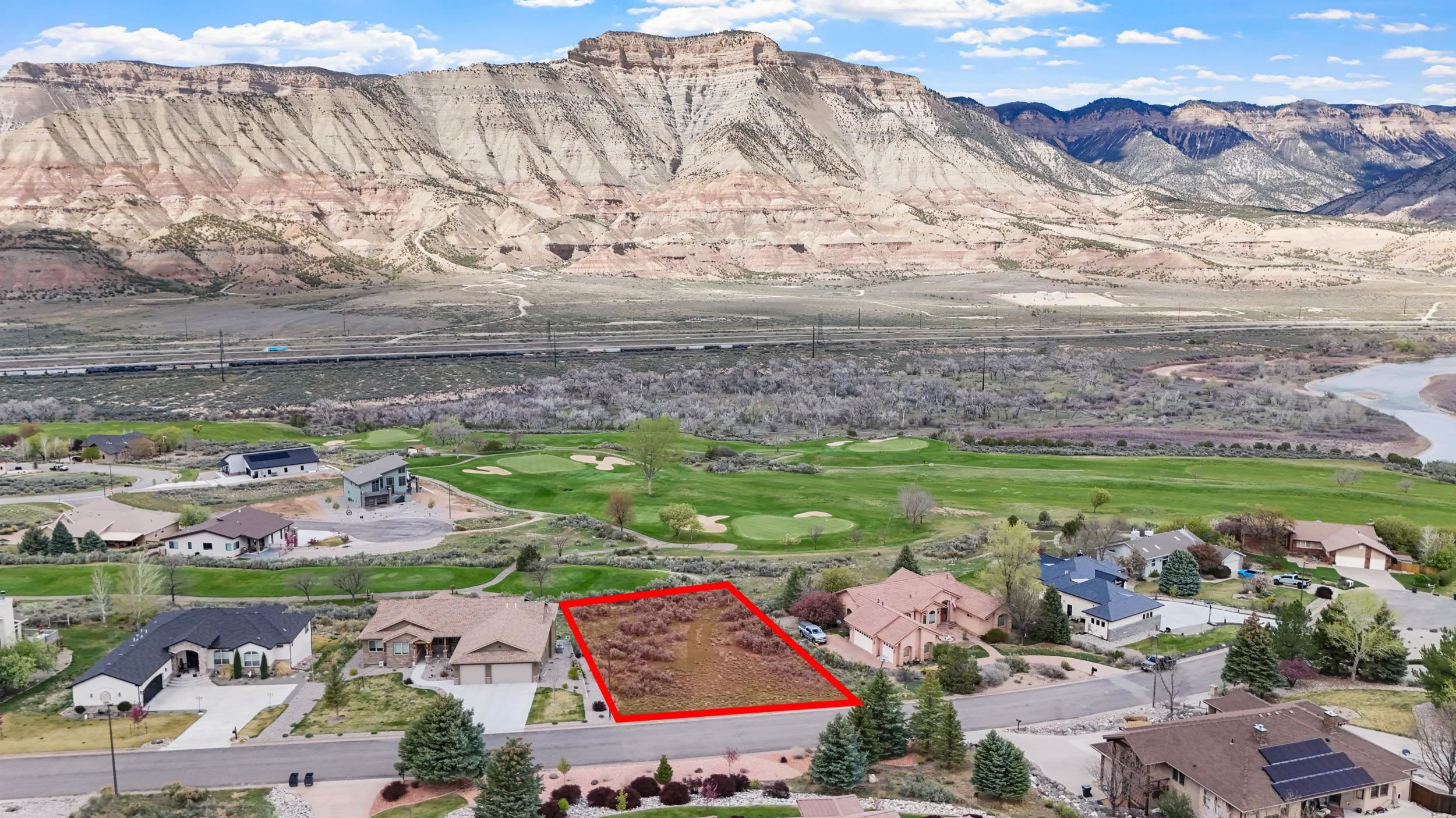 143 Boulder Ridge Drive Parachute, CO 81635 - Photo 8 of 11 a view of a city with an ocean