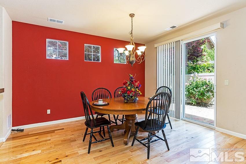 1815 Stetson Drive Reno, NV 89521 - Photo 6 of 20 a dining room with furniture a chandelier and window