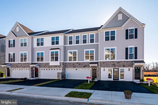 a front view of a building with many windows