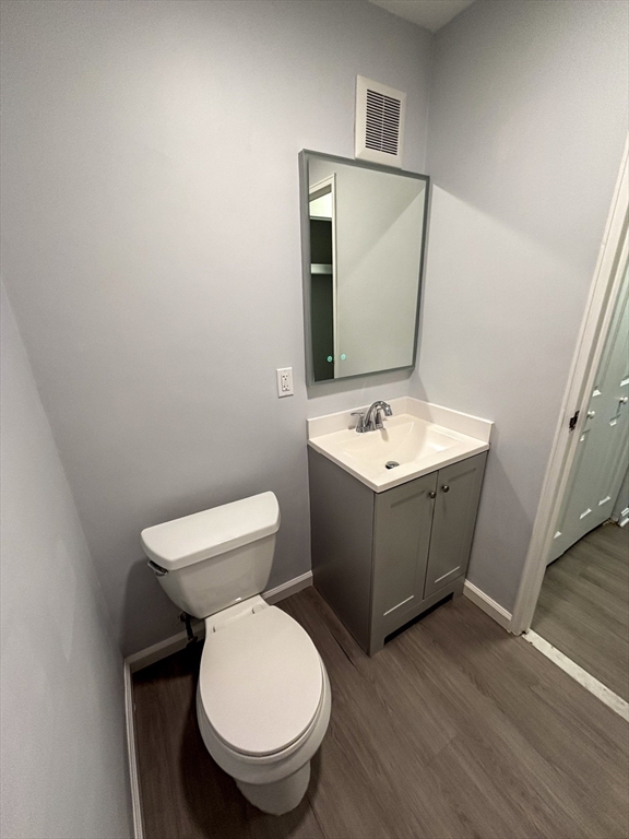 505 Washington, Unit 46 Chelsea, MA 02150 - Photo 12 of 16 a bathroom with a toilet sink and mirror