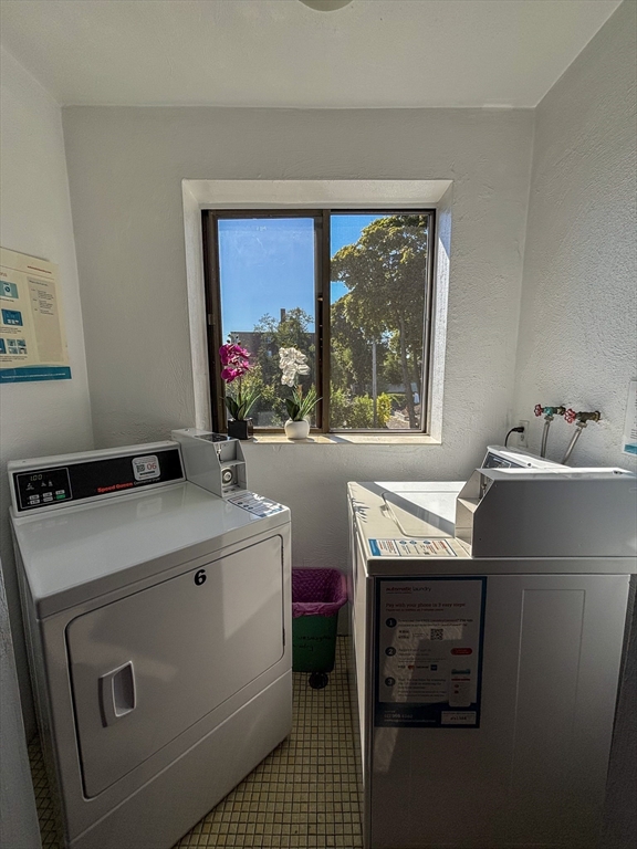 505 Washington, Unit 46 Chelsea, MA 02150 - Photo 16 of 16 a utility room with dryer and washer