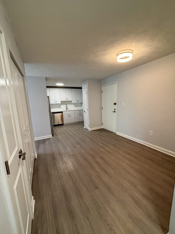 505 Washington, Unit 46 Chelsea, MA 02150 - Photo 6 of 16 wooden floor in an empty room with a window