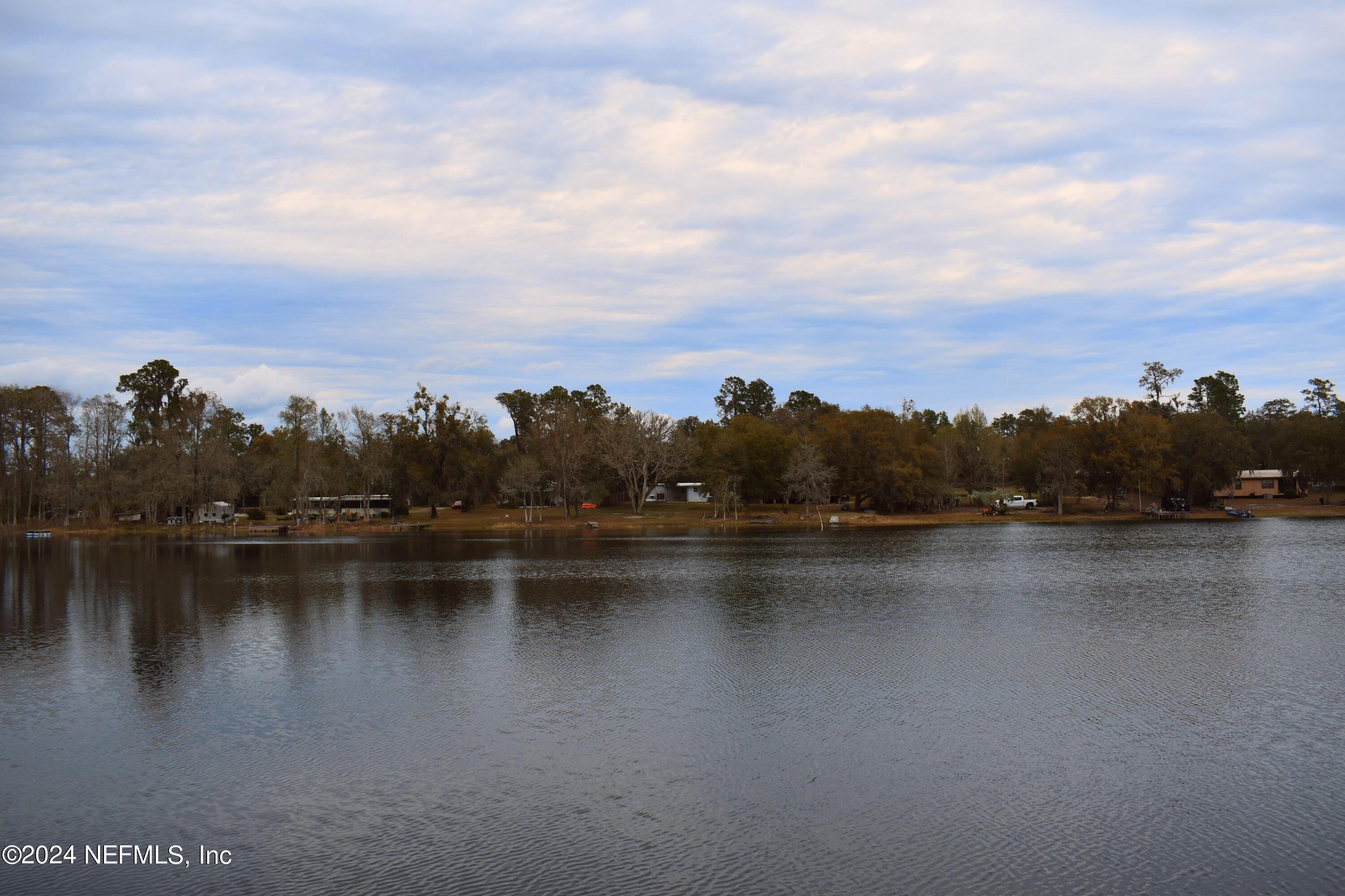 112 Hanson Road Interlachen, FL 32148 - Photo 11 of 13 a view of a lake with houses in the back