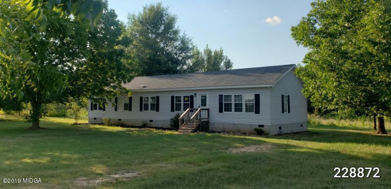 448 Scott Road Elko, GA 31025 - Photo 1 of 13 a view of a house with backyard and garden