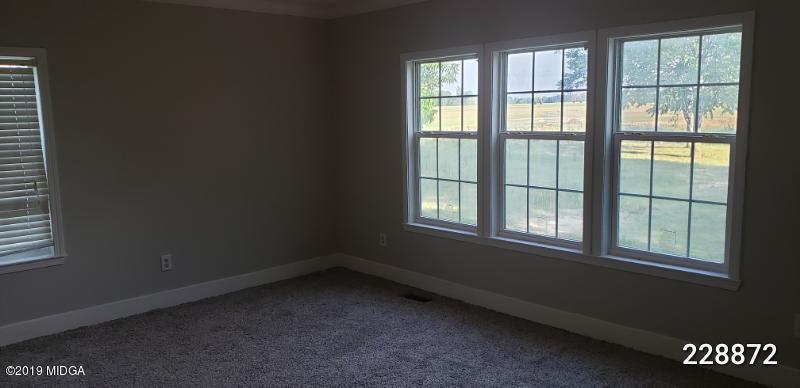 448 Scott Road Elko, GA 31025 - Photo 9 of 13 an empty room with a window