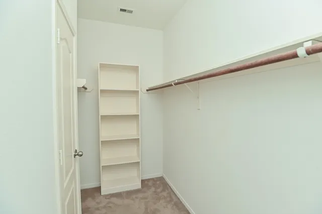 a view of an empty walk in closet