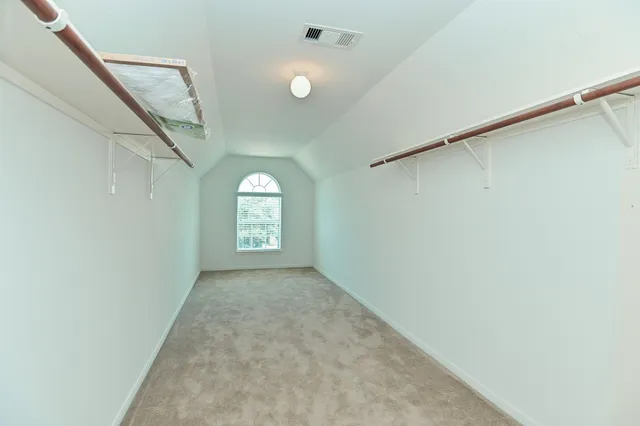 a view of a hallway with a window