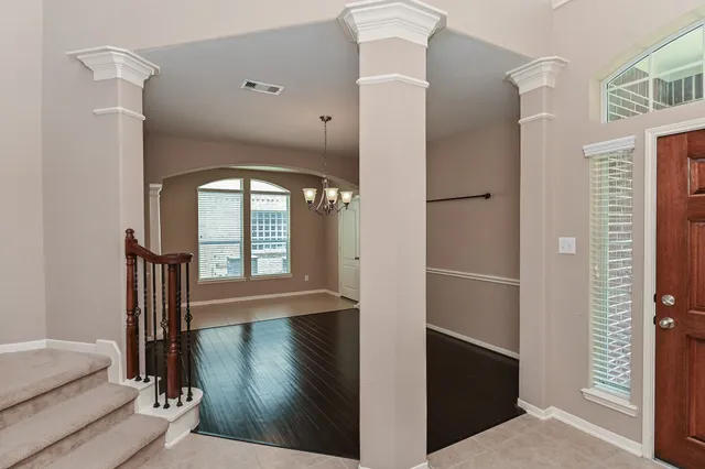 a view of entryway with wooden floor