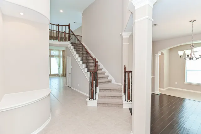 a view of entryway with wooden floor and stairs
