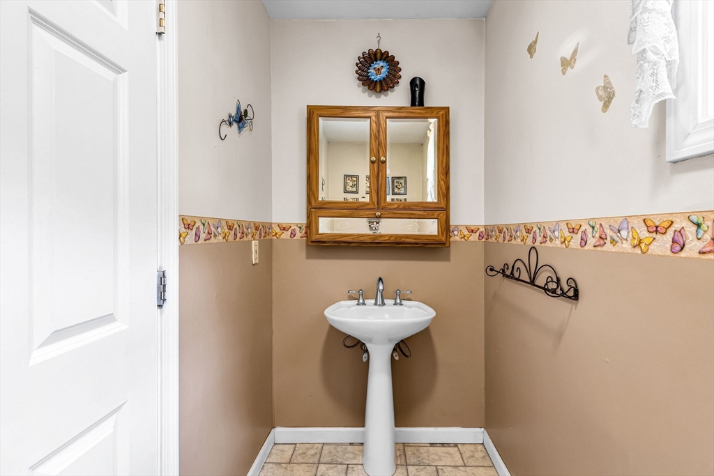 302 Middlefield Road Chester, MA 01011 - Photo 26 of 42 a bathroom with a sink and mirror