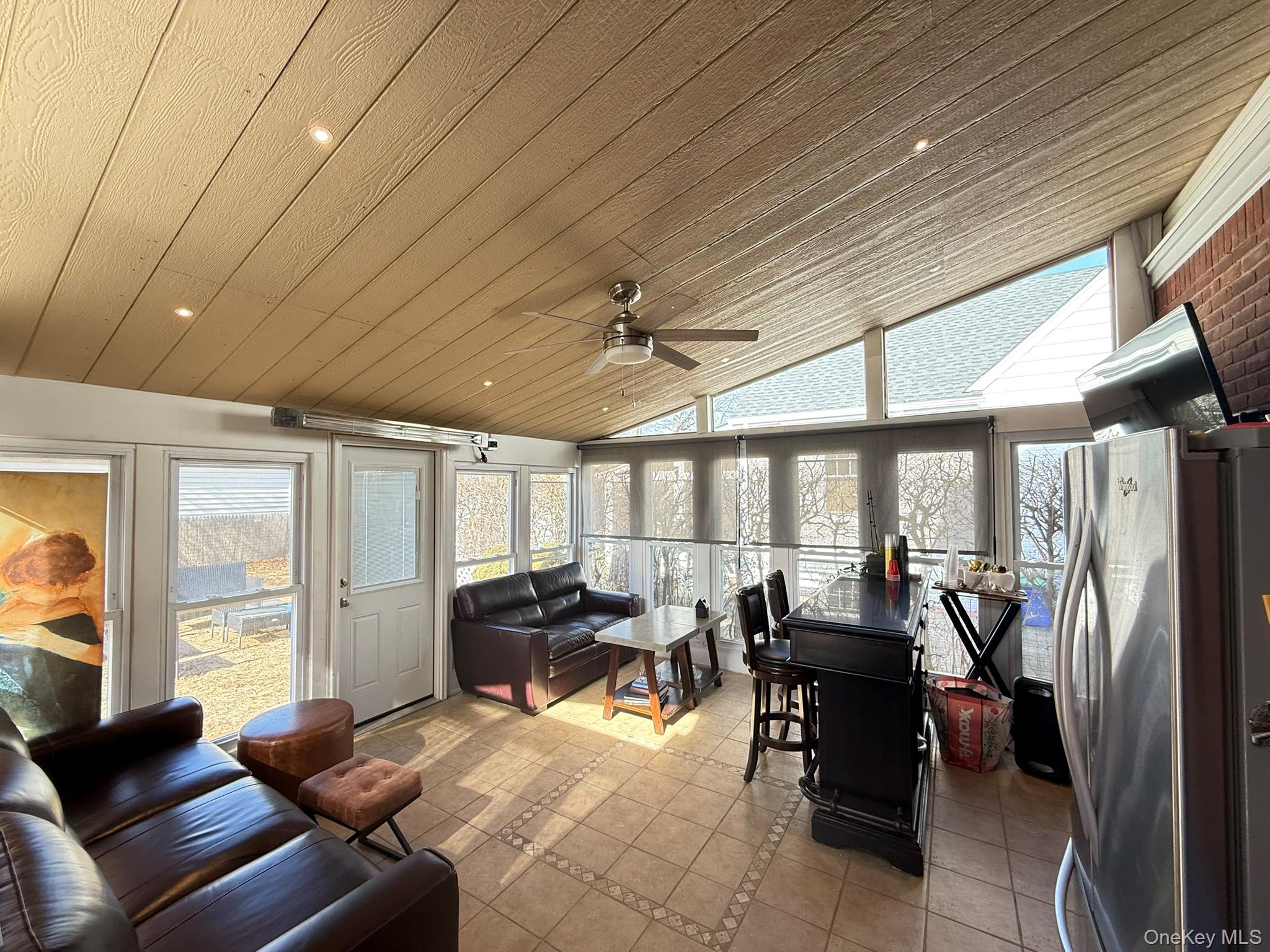 204 North Grove Street Valley Stream, NY 11580 - Photo 10 of 16 Sunroom featuring tile patterned floors, wooden ceiling, lofted ceiling, inlaid floor details, and recessed lighting