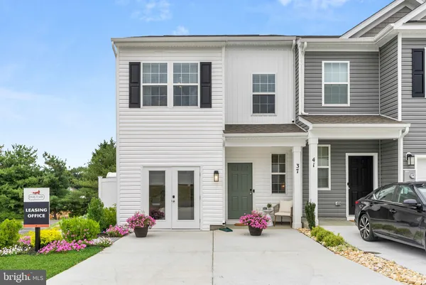a view of multiple houses with a city street