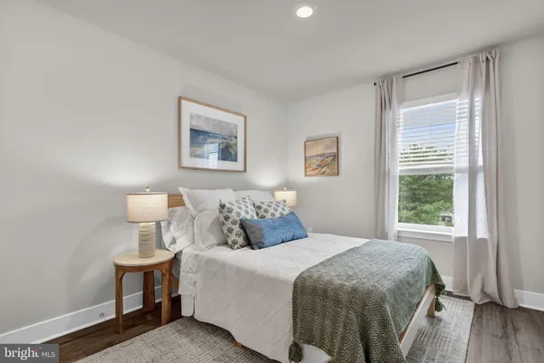 a bedroom with a bed and cabinets