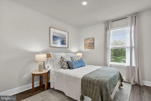 a bedroom with a bed and cabinets