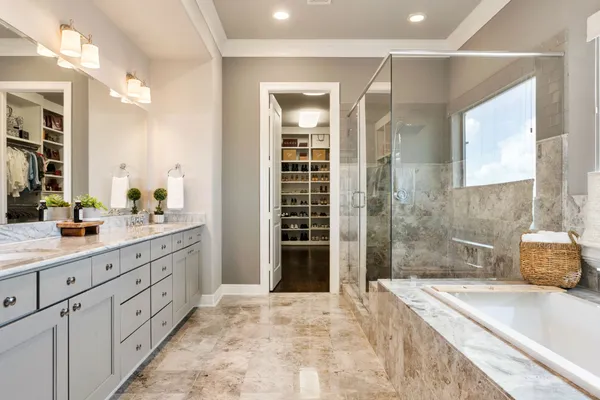 a bathroom with double sink and a mirror