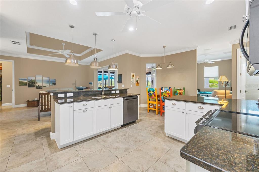 34 Brig Circle South Placida, FL 33946 - Photo 11 of 39 a large white kitchen with lots of counter space and appliances