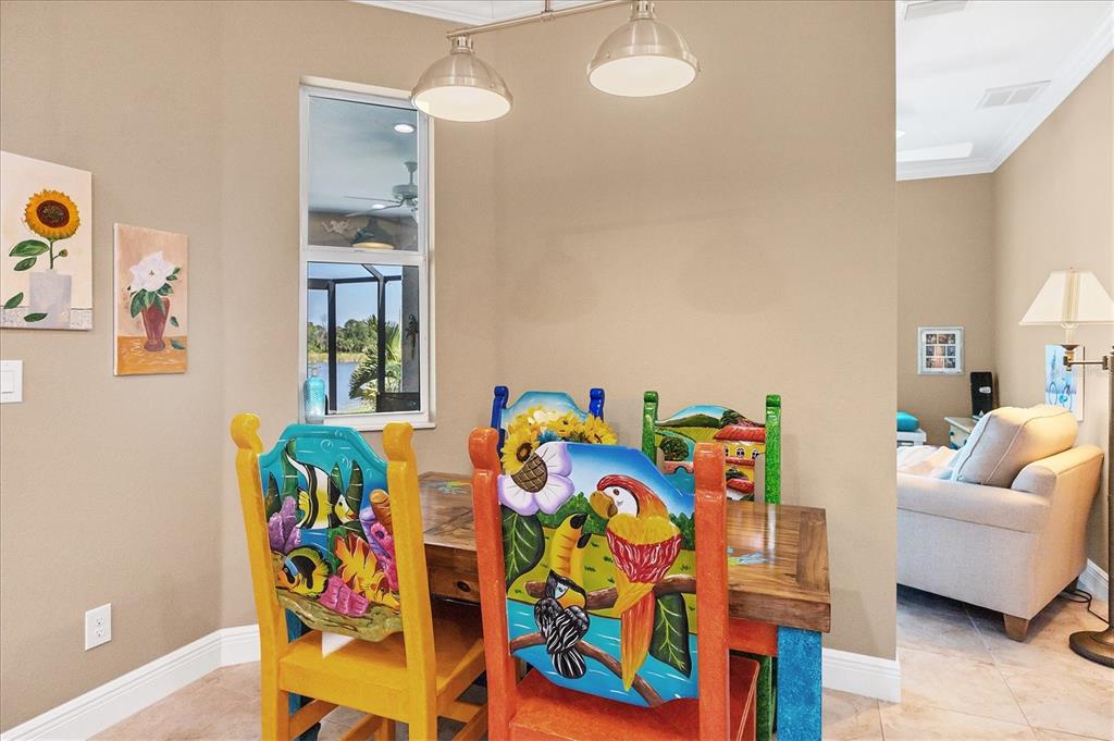 34 Brig Circle South Placida, FL 33946 - Photo 12 of 39 a living room with patio furniture and a dining table