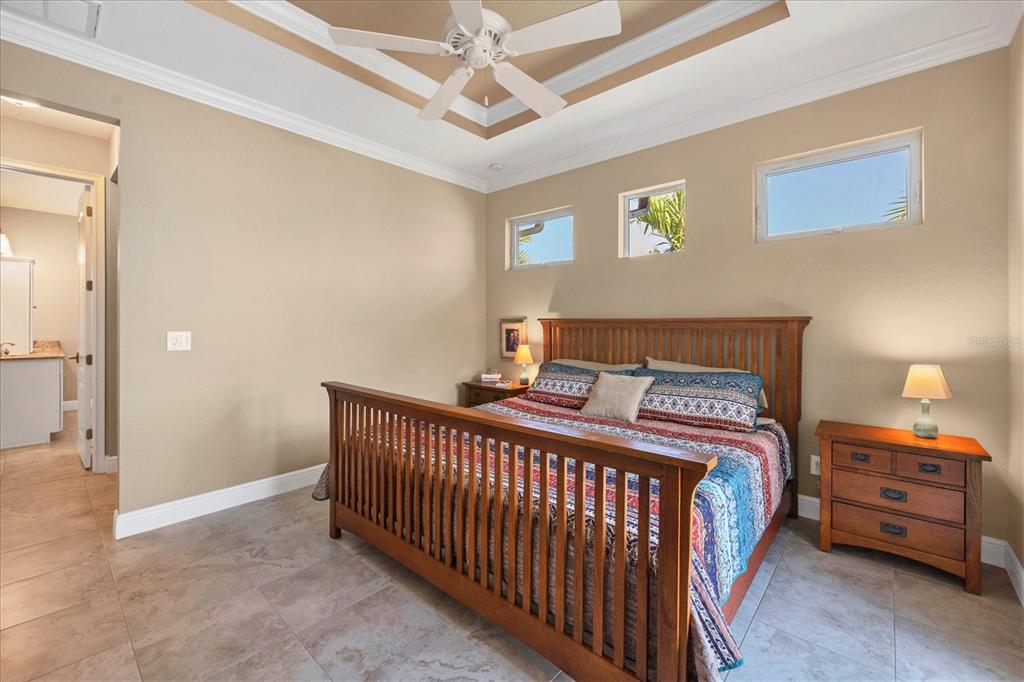 34 Brig Circle South Placida, FL 33946 - Photo 17 of 39 a bedroom with a bed and a chandelier