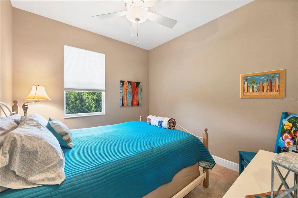 34 Brig Circle South Placida, FL 33946 - Photo 20 of 39 a bedroom with a bed and a painting on the wall