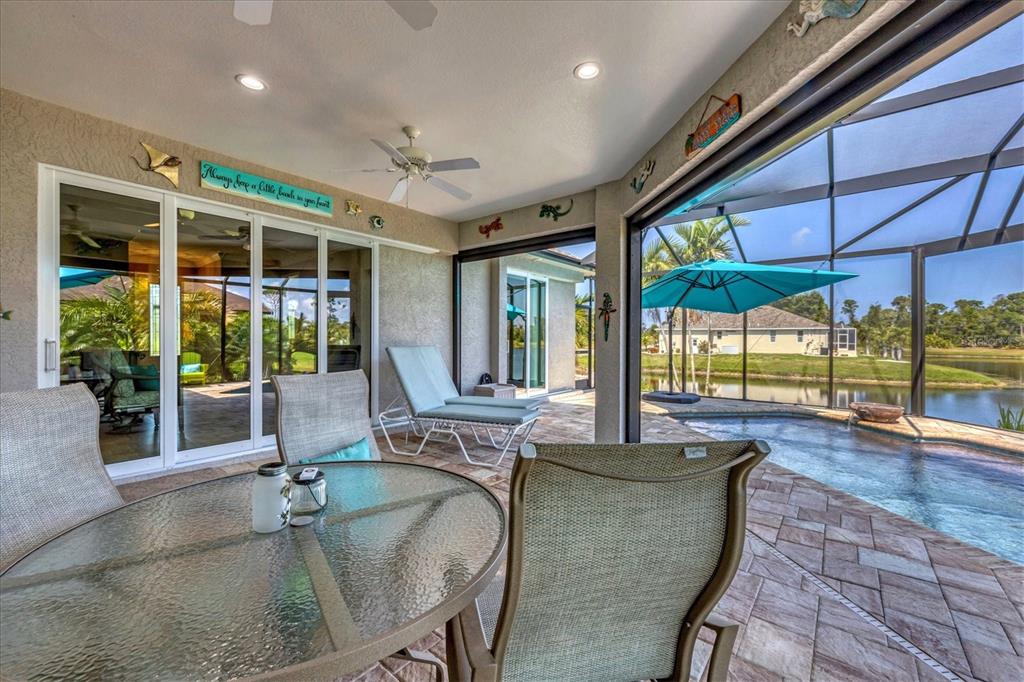 34 Brig Circle South Placida, FL 33946 - Photo 24 of 39 a dining room with furniture and large windows