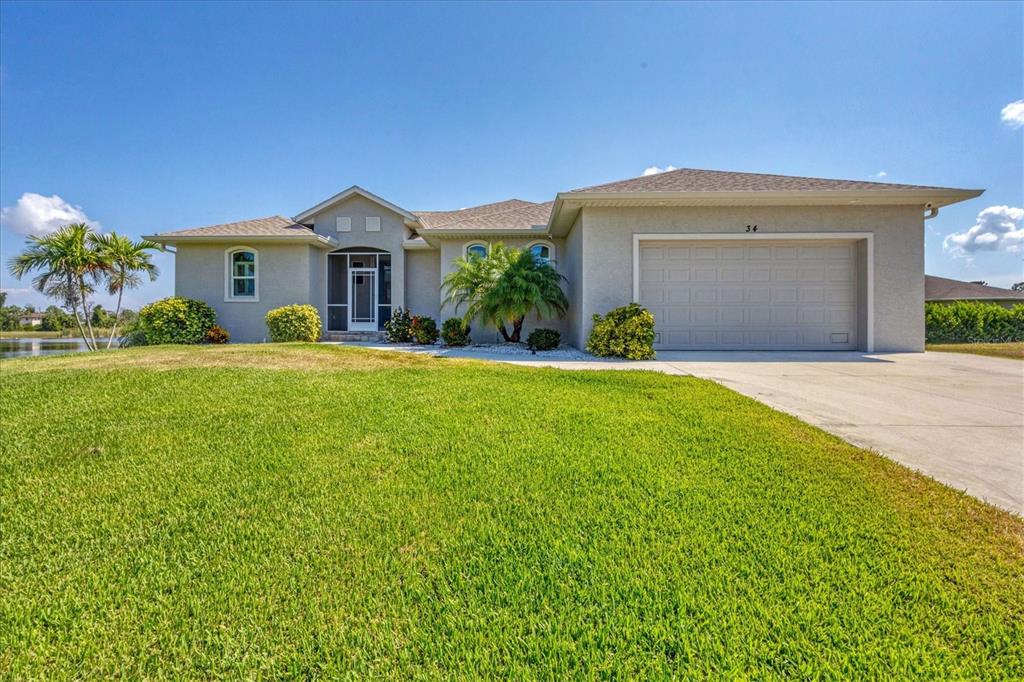 34 Brig Circle South Placida, FL 33946 - Photo 38 of 39 a front view of a house with a yard and garage