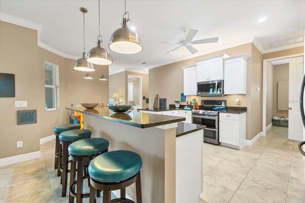 34 Brig Circle South Placida, FL 33946 - Photo 8 of 39 a kitchen with stainless steel appliances a stove a sink and a refrigerator