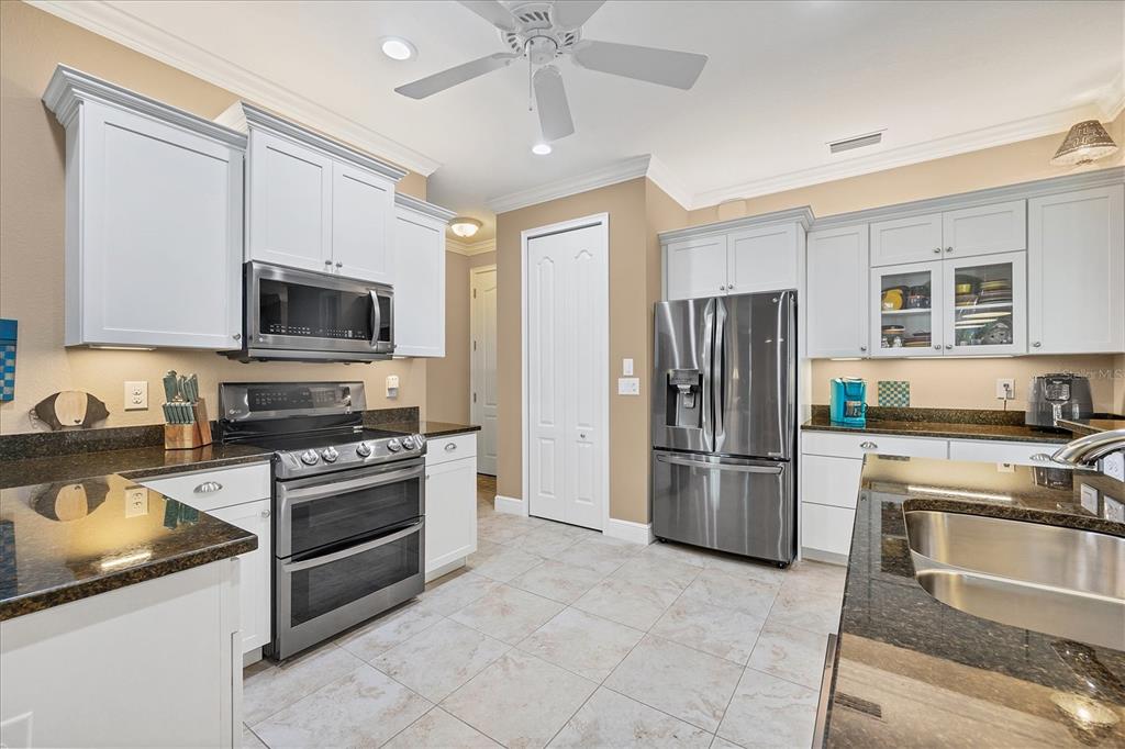 34 Brig Circle South Placida, FL 33946 - Photo 9 of 39 a kitchen with a stove a refrigerator and a sink