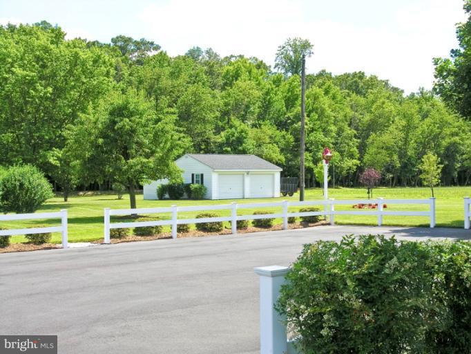 4629 Skinners Run Road Hurlock, MD 21643 - Photo 14 of 15 Paved drive, fencing, and detached garage