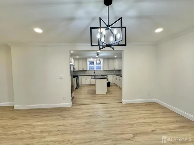 a bathroom with a sink vanity and mirror