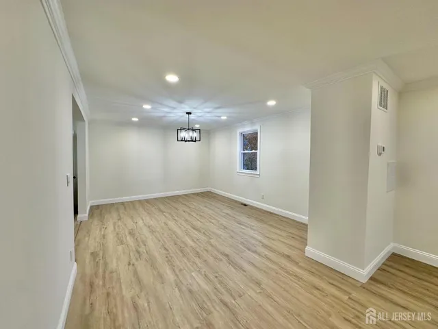a bathroom with a sink a mirror and shower