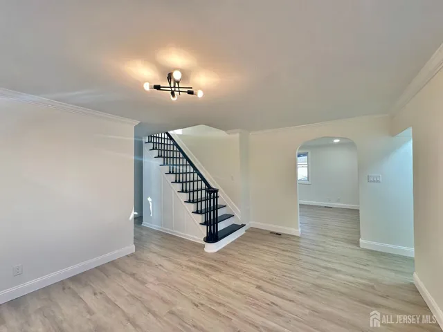 a kitchen with granite countertop stainless steel appliances a stove microwave and sink