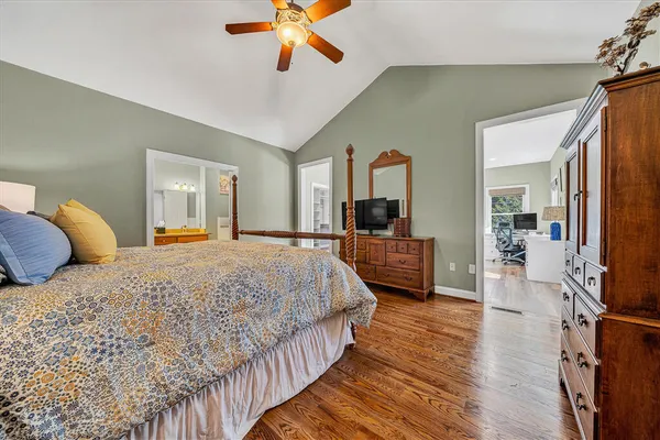 a bed room with a bed and a dresser
