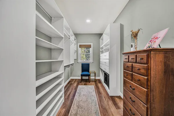 a bathroom with a sink toilet vanity tub and shower