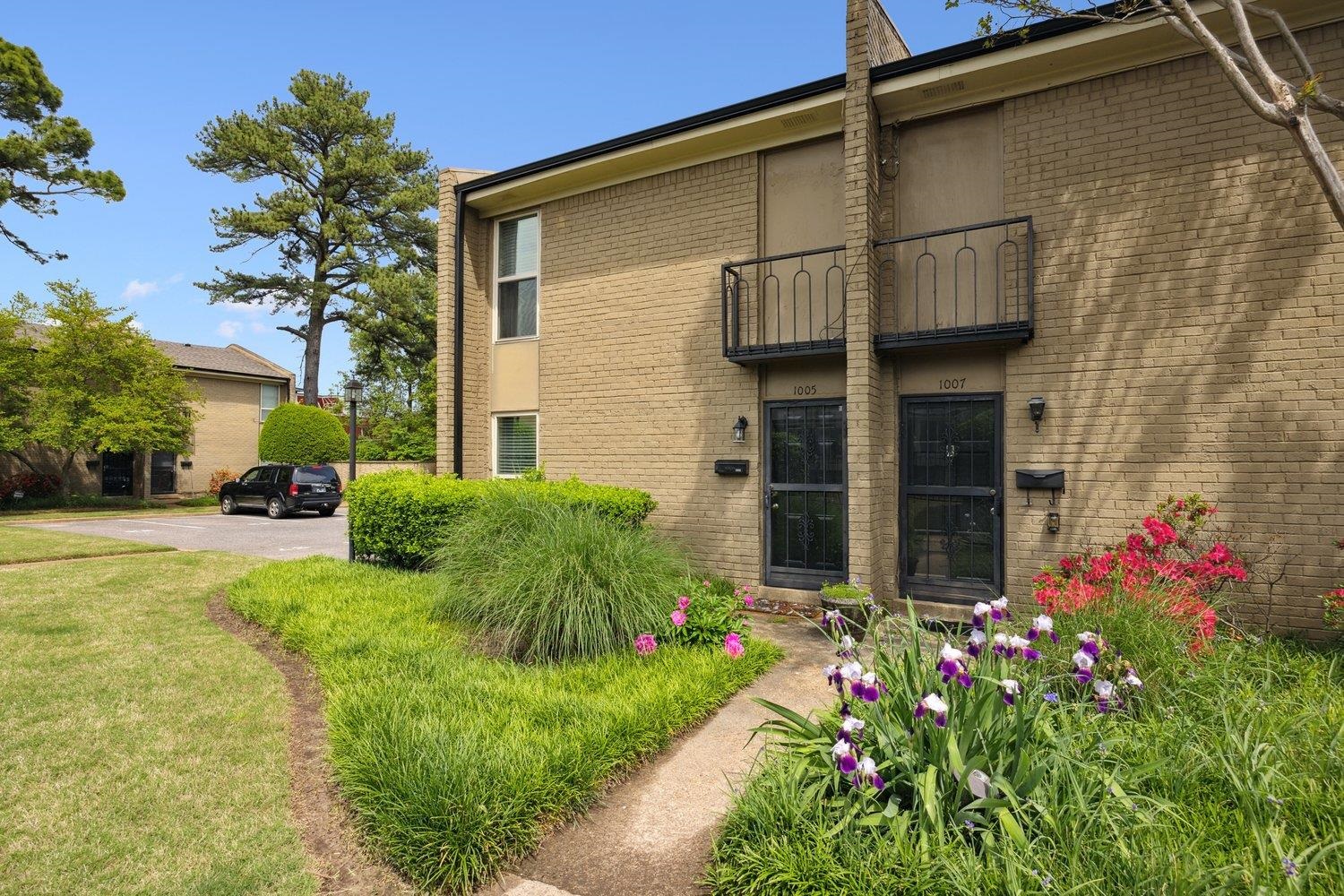 1005 June Road Memphis, TN 38119 - Photo 1 of 22 View of front of property with a front lawn, brick siding, and a balcony