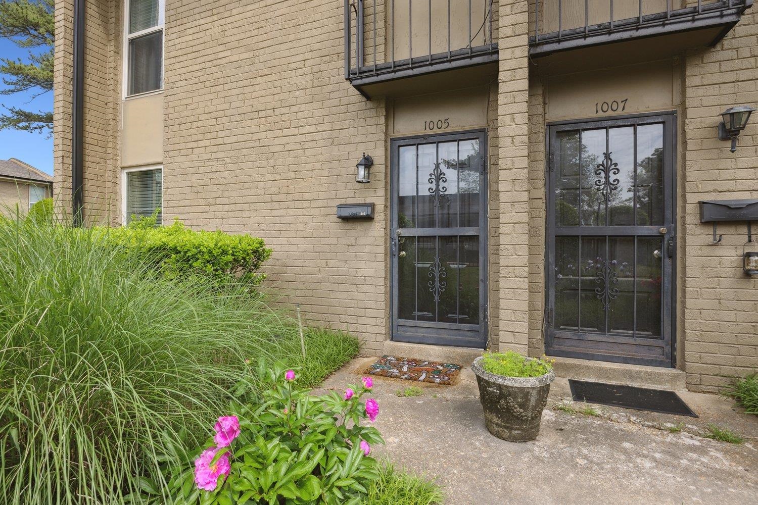 1005 June Road Memphis, TN 38119 - Photo 3 of 22 Doorway to property with brick siding and a balcony