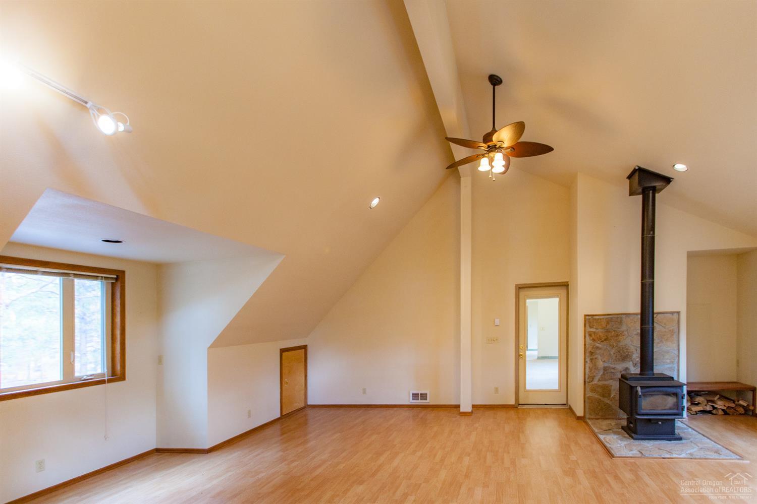 60232 East Ridgeview Drive Bend, OR 97702 - Photo 15 of 23 a view of a room with gym equipment and wooden floor