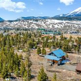 a view of a terrace with furniture and a city view