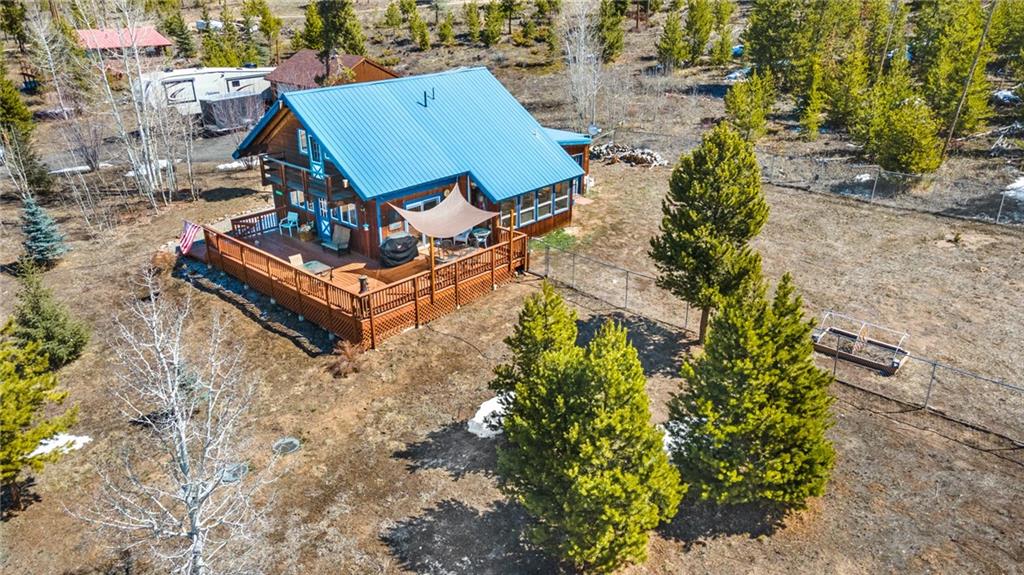 567 G Road Silverthorne, CO 80498 - Photo 2 of 32 an aerial view of a house with swimming pool and large trees