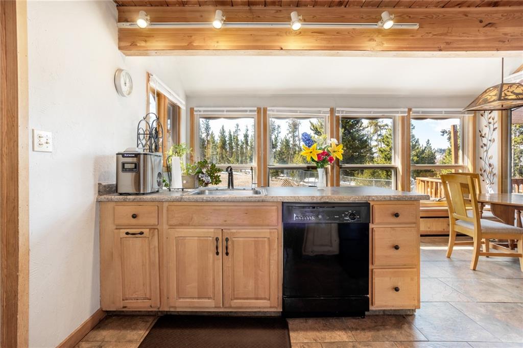 567 G Road Silverthorne, CO 80498 - Photo 12 of 32 a kitchen with stainless steel appliances a sink and large window