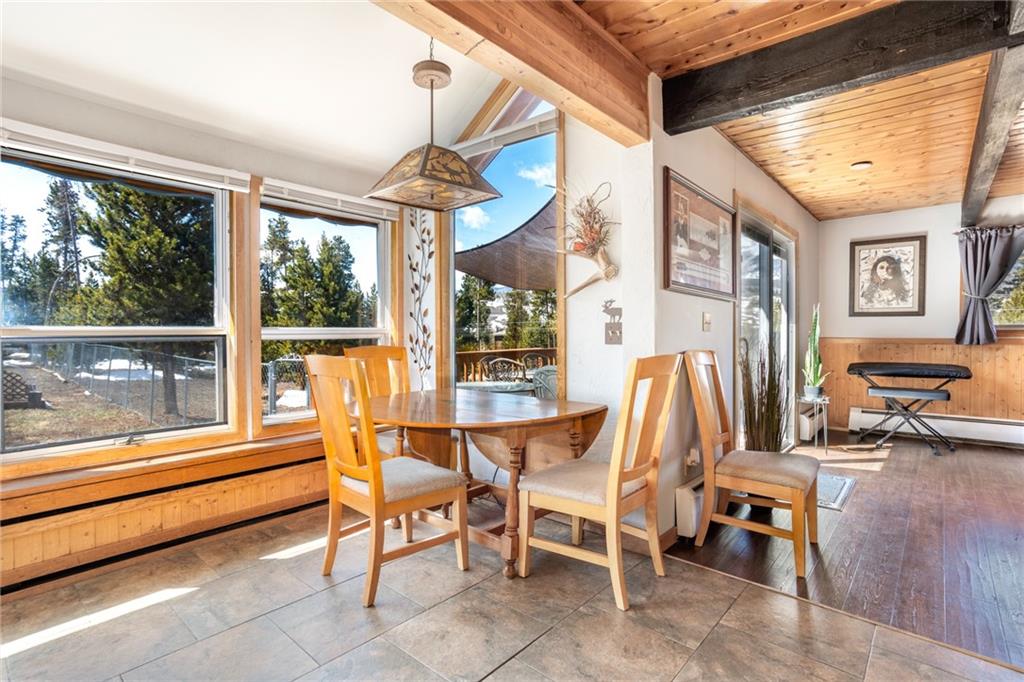 567 G Road Silverthorne, CO 80498 - Photo 13 of 32 a dining room with furniture and large windows
